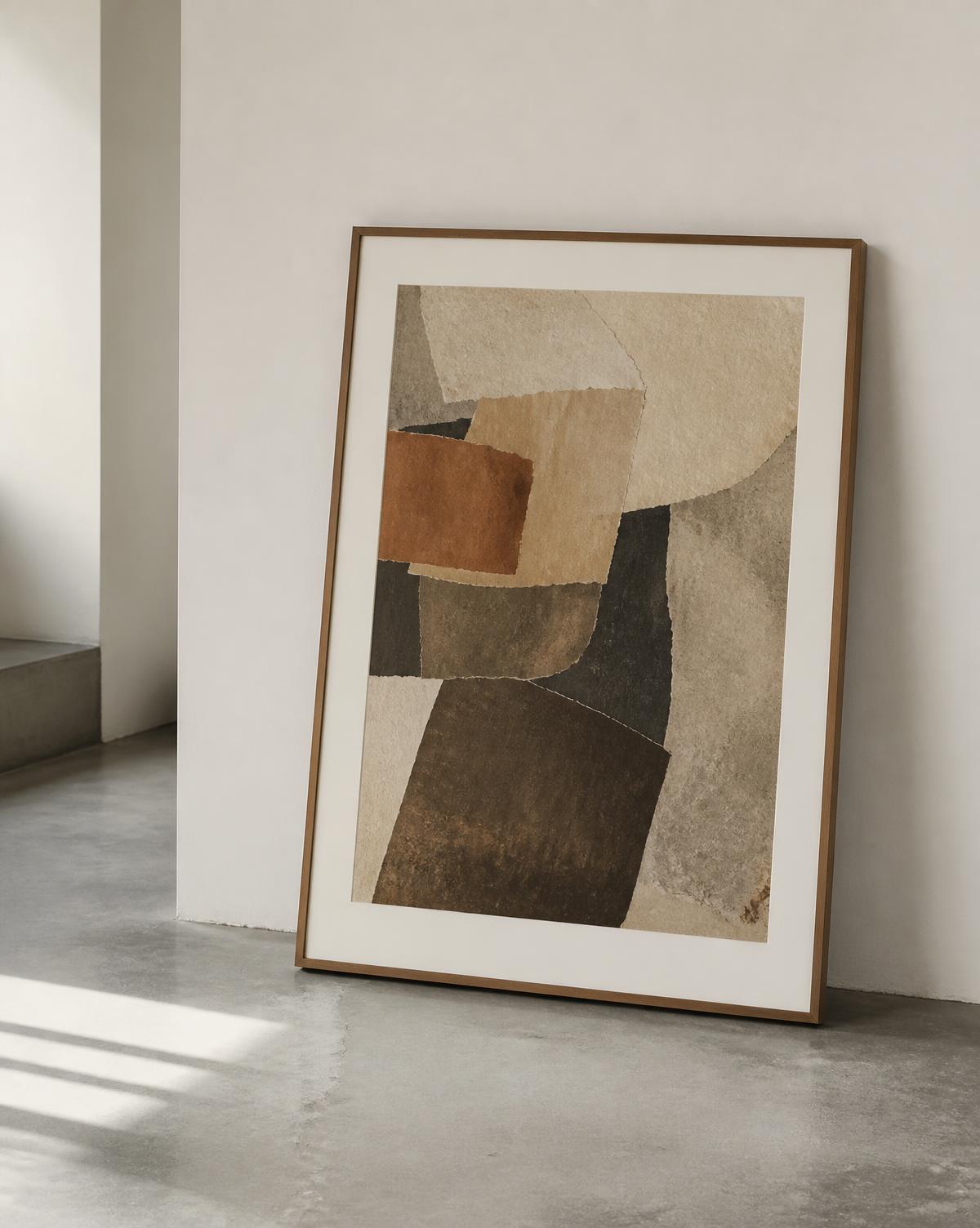 Framed print leaning against a pale wall